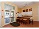 Well-equipped community kitchen with granite counters and bar seating at 4230 Castlebridge Ln # 1821, Sarasota, FL 34238