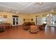 Community room features tiled floors, comfy seating, and a kitchenette at 4230 Castlebridge Ln # 1821, Sarasota, FL 34238