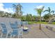 Community fire pit with seating for relaxing evenings at 4230 Castlebridge Ln # 1821, Sarasota, FL 34238