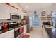 Modern kitchen with stainless steel appliances and granite countertops at 4230 Castlebridge Ln # 1821, Sarasota, FL 34238