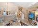 Spacious living room with comfortable seating and a view of the stairs at 4230 Castlebridge Ln # 1821, Sarasota, FL 34238