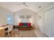 Home office featuring a sofa, desk, and ample natural light at 4230 Castlebridge Ln # 1821, Sarasota, FL 34238