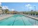 Inviting resort-style pool with ample lounge chairs at 4230 Castlebridge Ln # 1821, Sarasota, FL 34238