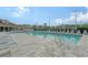 Resort-style pool with plenty of lounge chairs at 4230 Castlebridge Ln # 1821, Sarasota, FL 34238