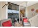 Private screened balcony with seating and view of the pool area at 4230 Castlebridge Ln # 1821, Sarasota, FL 34238