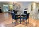 Bright dining area with a glass-top table and black leather chairs at 4258 Marlowe Dr, Sarasota, FL 34241