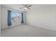 Well-lit bedroom featuring a ceiling fan and window at 433 Tierra Verde Way, Bradenton, FL 34212