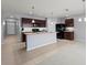 Modern kitchen with an island and breakfast bar at 433 Tierra Verde Way, Bradenton, FL 34212