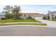 Front view of a single-story house with a well-manicured lawn at 4477 Opal Ct, Sarasota, FL 34233