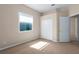 Well-lit bedroom with neutral carpet and double-door closet at 4505 70Th E Ave, Ellenton, FL 34222