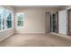 Bright bedroom with neutral carpeting and access to the pool at 4505 70Th E Ave, Ellenton, FL 34222