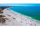 Aerial view of beach with people and umbrellas at 475 Benjamin Franklin Dr # 215, Sarasota, FL 34236