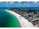 Drone shot of beach, coastline, and buildings at 475 Benjamin Franklin Dr # 215, Sarasota, FL 34236