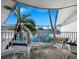 Balcony with seating and partial ocean view at 475 Benjamin Franklin Dr # 215, Sarasota, FL 34236