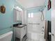 Clean bathroom with tub, shower, and granite vanity at 475 Benjamin Franklin Dr # 215, Sarasota, FL 34236