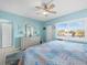 Bedroom with king-size bed, dresser, and window with shutters at 475 Benjamin Franklin Dr # 215, Sarasota, FL 34236