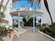 The Dorset building entrance with lush landscaping at 475 Benjamin Franklin Dr # 215, Sarasota, FL 34236