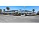 Lido Dorset building exterior, featuring a mid-century modern design and ample parking at 475 Benjamin Franklin Dr # 215, Sarasota, FL 34236