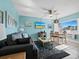 Living room and dining area with light blue walls and coastal decor at 475 Benjamin Franklin Dr # 215, Sarasota, FL 34236