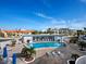Community pool with lounge chairs and patio area at 475 Benjamin Franklin Dr # 215, Sarasota, FL 34236