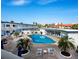 Inviting community pool with surrounding lounge chairs at 475 Benjamin Franklin Dr # 215, Sarasota, FL 34236