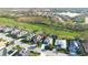 Aerial view of the house in its neighborhood, with a view of the golf course and a waterway nearby at 4837 88Th E St, Bradenton, FL 34211