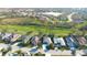 An aerial view highlights the property's desirable location within a community close to a lake, golf course, and green space at 4837 88Th E St, Bradenton, FL 34211
