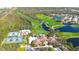 Aerial view of community amenities including tennis courts, pool, and the clubhouse near a golf course at 4837 88Th E St, Bradenton, FL 34211
