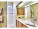 Bathroom featuring shower, vanity with a sink and a mirrored wall cabinet at 4837 88Th E St, Bradenton, FL 34211
