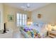 Bedroom with bright, colorful decor and a window with white shutters at 4837 88Th E St, Bradenton, FL 34211