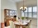 Traditional dining room with a wood table set for dinner with a window view at 4837 88Th E St, Bradenton, FL 34211