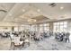 Elegant dining room with ample seating, chandelier, and large windows offering natural light at 4837 88Th E St, Bradenton, FL 34211