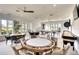 Spacious game room with poker table, pool table, and shuffleboard at 4837 88Th E St, Bradenton, FL 34211