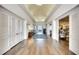 Open hallway with hardwood floors, decorative lighting, and access to other areas, and closet space at 4837 88Th E St, Bradenton, FL 34211