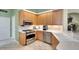 Well-equipped kitchen featuring stainless steel appliances, ample cabinet space, and a bright, functional layout at 4837 88Th E St, Bradenton, FL 34211