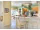Open-concept kitchen with breakfast bar that overlooks a cozy dining nook at 4837 88Th E St, Bradenton, FL 34211