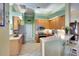 Bright kitchen featuring wooden cabinets, stainless steel appliances, and white countertops at 4837 88Th E St, Bradenton, FL 34211