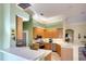Well-lit kitchen featuring wooden cabinets, stainless steel appliances and a breakfast bar at 4837 88Th E St, Bradenton, FL 34211