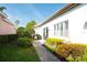 Charming patio area with lush landscaping and a paved walkway, perfect for outdoor relaxation at 4837 88Th E St, Bradenton, FL 34211
