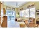 Sitting room with comfortable chairs and a sliding glass door to the pool area at 4837 88Th E St, Bradenton, FL 34211