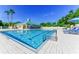 Sparkling swimming pool with lounge chairs and a pool house at 4837 88Th E St, Bradenton, FL 34211