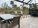 Covered patio with seating area and dining set at 5324 Popoli Way, Sarasota, FL 34238