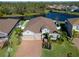 Aerial view of a single-Gathering home with a large backyard and a lake at 5522 69Th E Pl, Ellenton, FL 34222