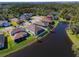 Aerial view showcasing a house's location on a lake at 5522 69Th E Pl, Ellenton, FL 34222