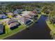 Aerial view of houses and a lake, showcasing community at 5522 69Th E Pl, Ellenton, FL 34222