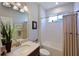 Simple bathroom with shower/tub combo and beige tile at 5522 69Th E Pl, Ellenton, FL 34222