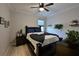 Guest bedroom with dark wood platform bed and navy bedding at 5522 69Th E Pl, Ellenton, FL 34222