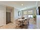 Bright dining room with rustic table and chairs, perfect for Gathering meals at 5522 69Th E Pl, Ellenton, FL 34222