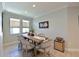 Casual dining area with rustic farmhouse table and chairs at 5522 69Th E Pl, Ellenton, FL 34222