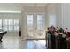 Bright entryway with double doors and decorative glass insets at 5522 69Th E Pl, Ellenton, FL 34222